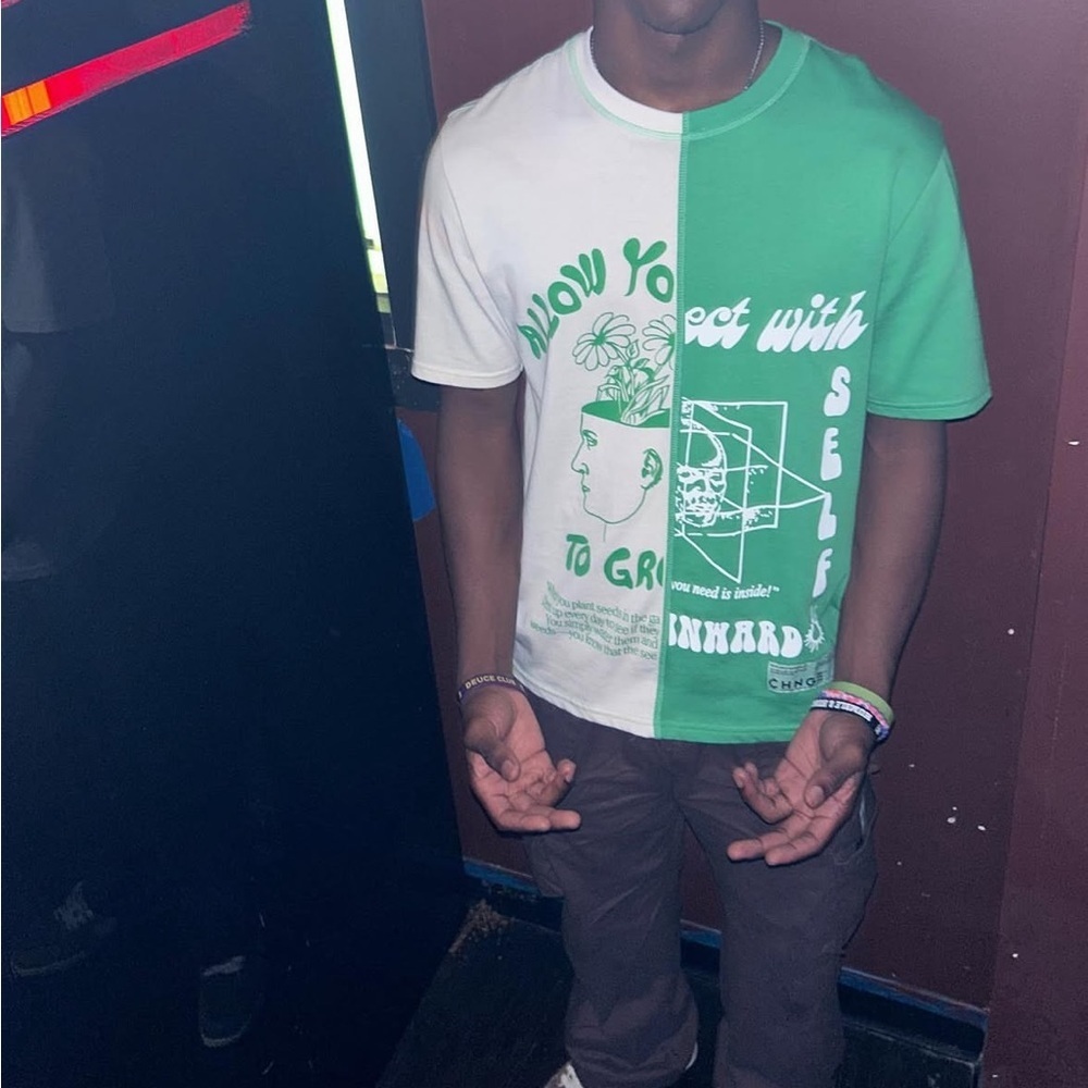 CHNGE CHNGE split-color graphic t-shirt.
